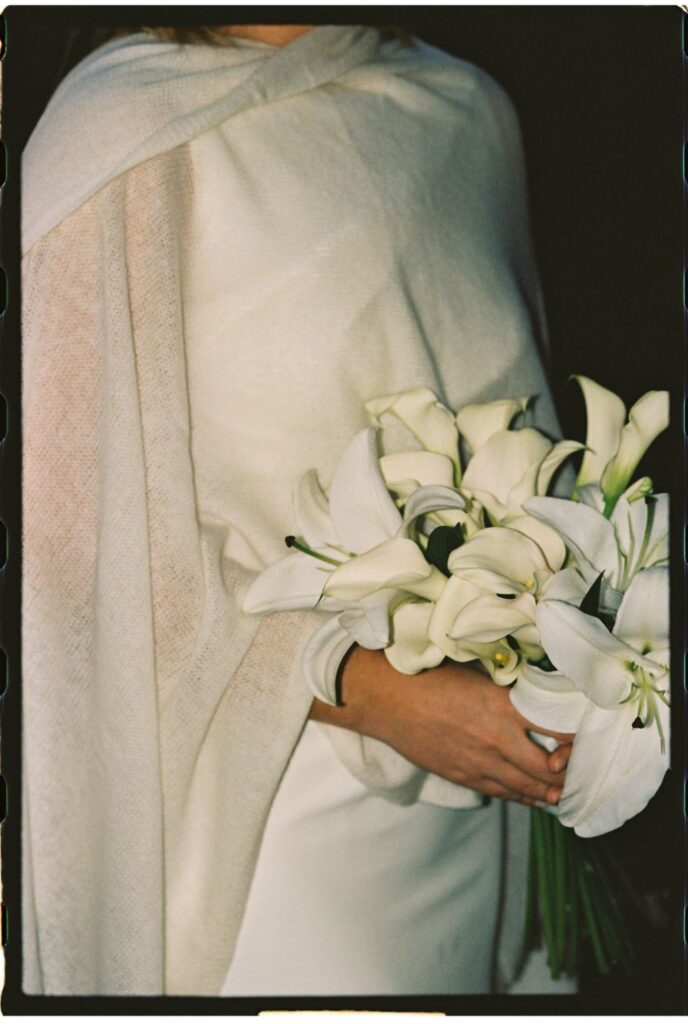 Flash film photography of the bride's bouquet after dark by a Vermont and New England wedding photographer specializing in authentic, cinematic, and candid moments.