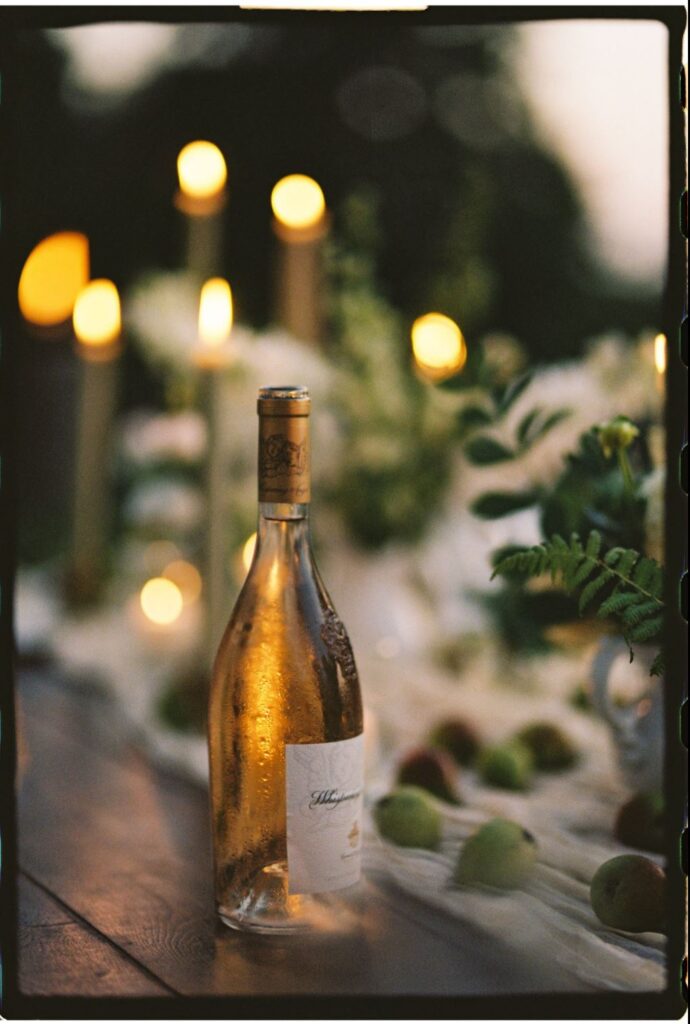 A beautiful table setting for an intimate and elegant outdoor wedding, captured on film by a Vermont and New England wedding photographer specializing in authentic, cinematic, and candid moments.