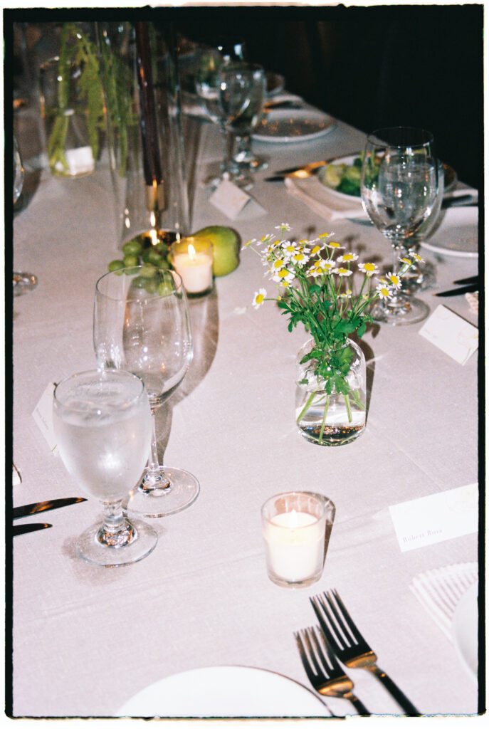 Flash film photo of a wedding reception table taken by a Vermont and New England wedding photographer, featuring vintage tones and elegant table details