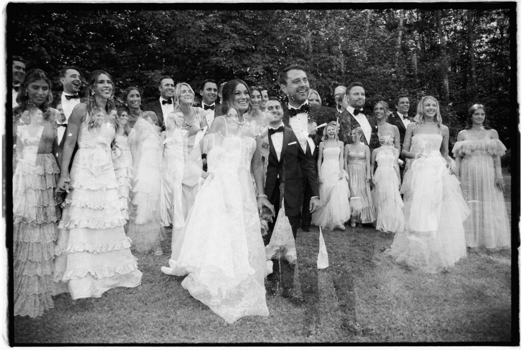 A double exposure image on 35mm film of a large wedding party for an elevated garden party style wedding in Vermont
